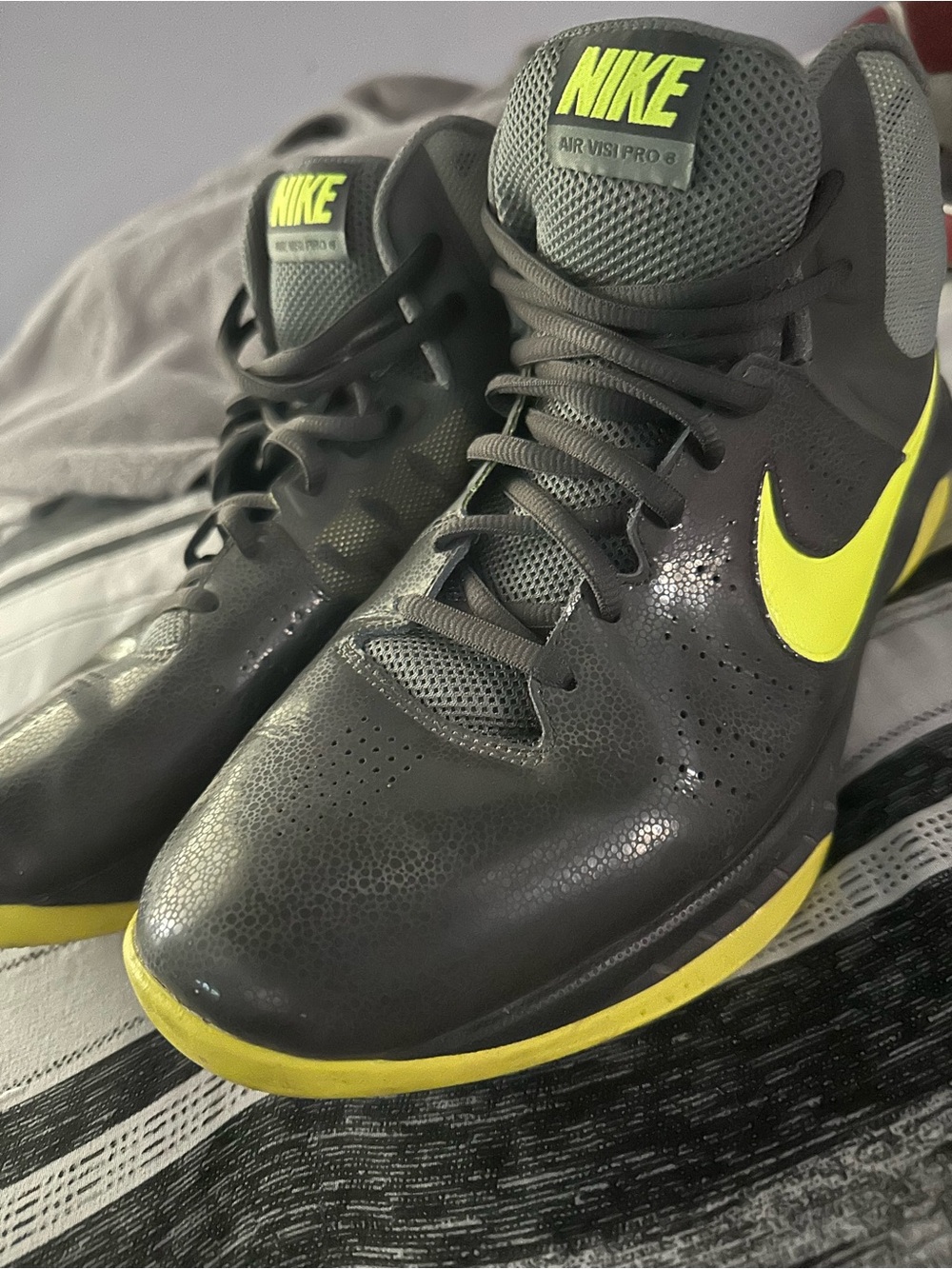 Nike Gray Basketball Shoes with Yellow Swoosh